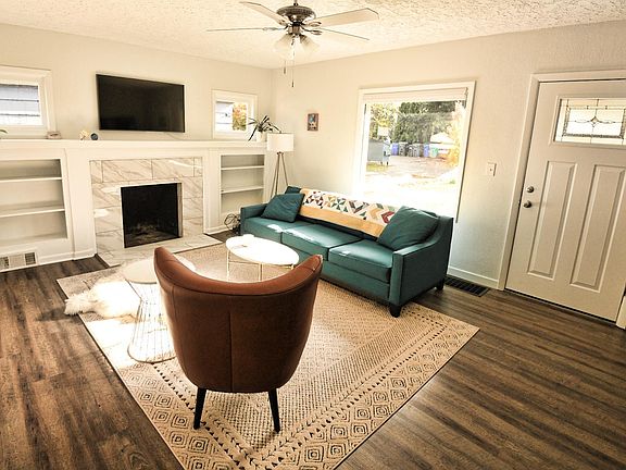 Living room / front door. Fireplace decorative.