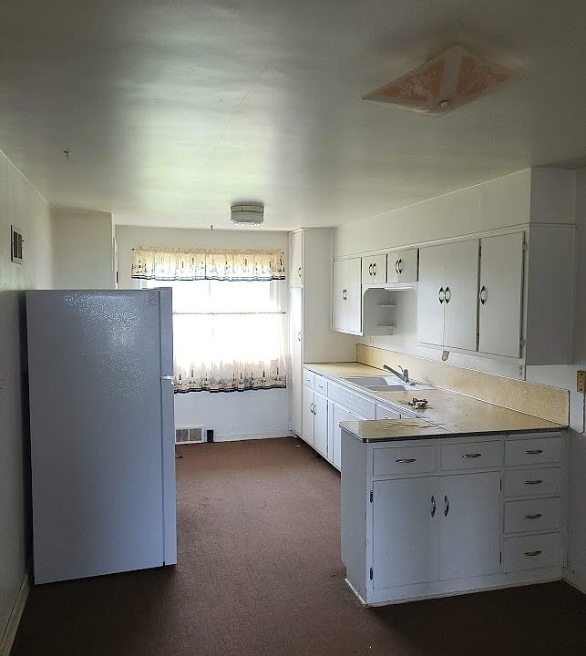 Kitchen, small dining area to the right in the foreground.