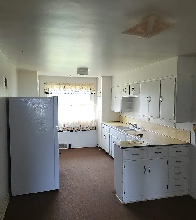 Kitchen, small dining area to the right in the foreground.