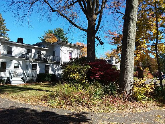 Back of House showing side yard and deck entrance to 4A Leahey Ave. 1st floor