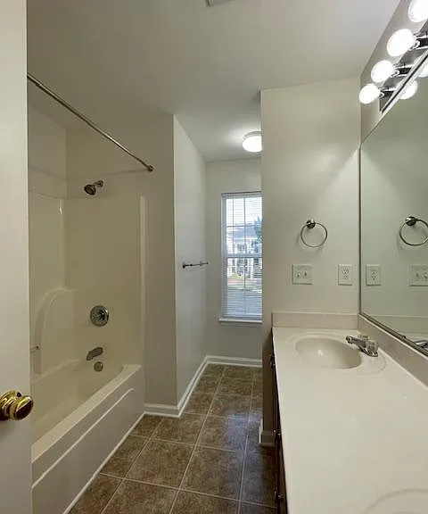 Master ensuite includes duel sink, tub/shower, and privacy section for the commode.
