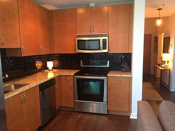 Granite countertops and stainless steel appliances.