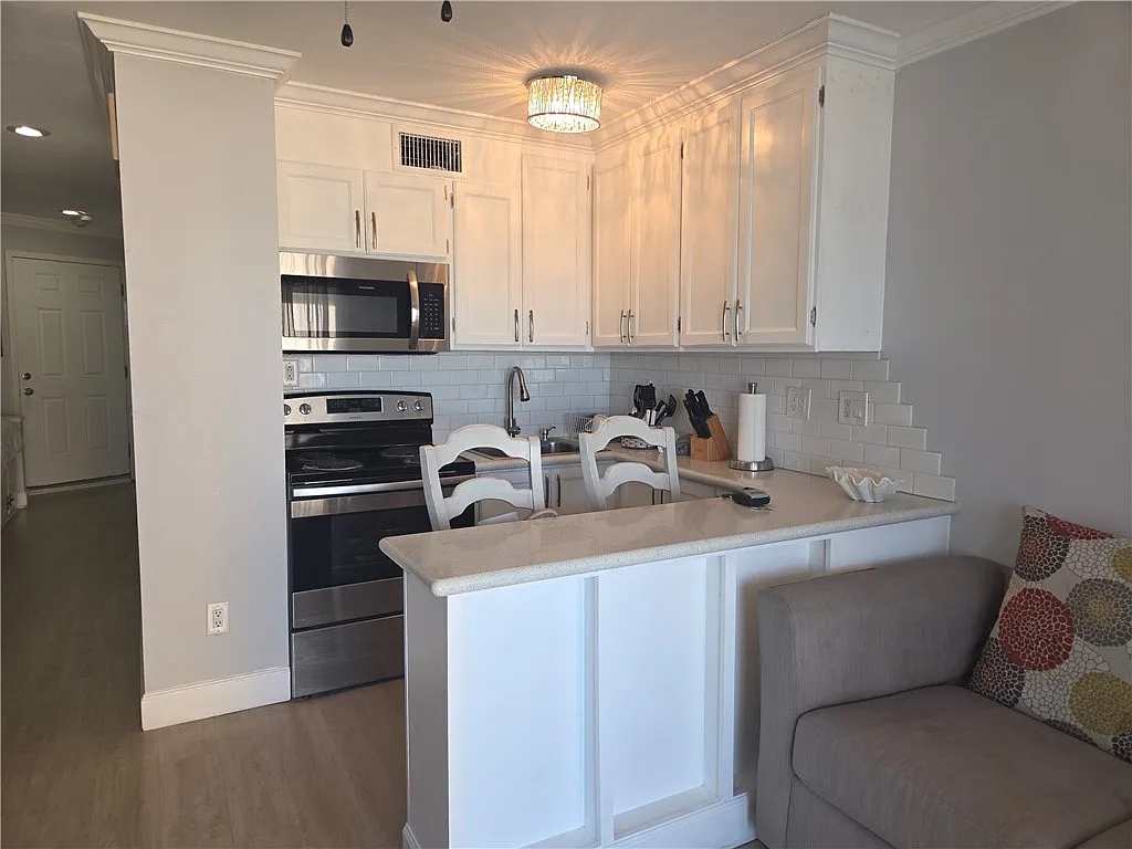 Building Photo - 3938 Surfside Blvd #3325