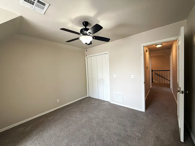 The 4th bedroom entrance and closet doors.