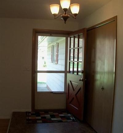 View of entry from kitchen, new flooring
