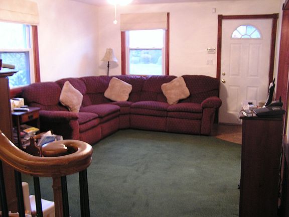 living room with archway to formal dining room