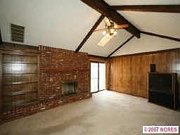 Vaulted ceiling in family room w/built in shelves, fireplace and skylight 