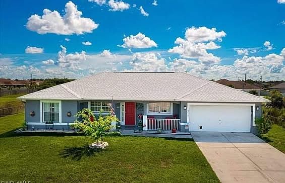 The House with large fenced-in patio area offering privacy and a comfortable outdoor space to enjoy