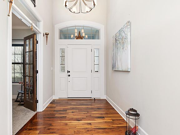 Welcome into a spacious and inviting main hallway, setting the tone for this elegant home with its bright, open feel.