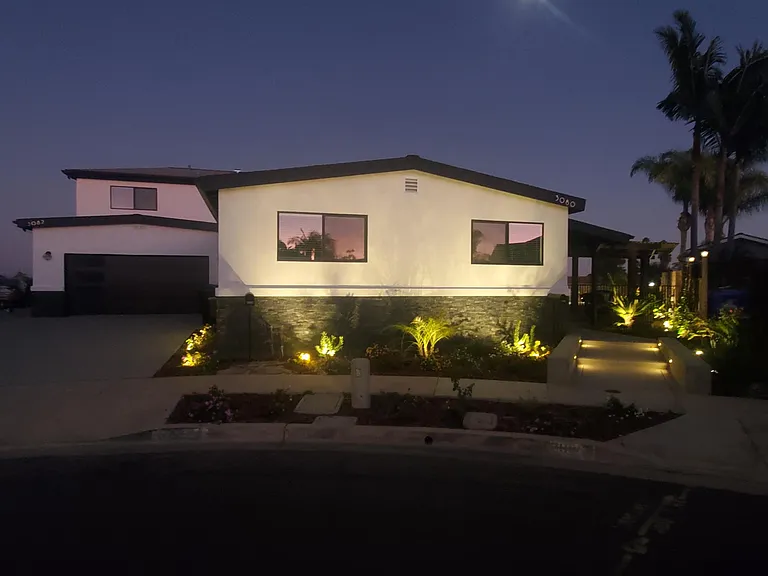 New black windows, and white stucco.
