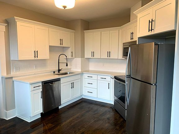 Kitchen - stainless appliances include dishwasher, oven, microwave and refrigerator.