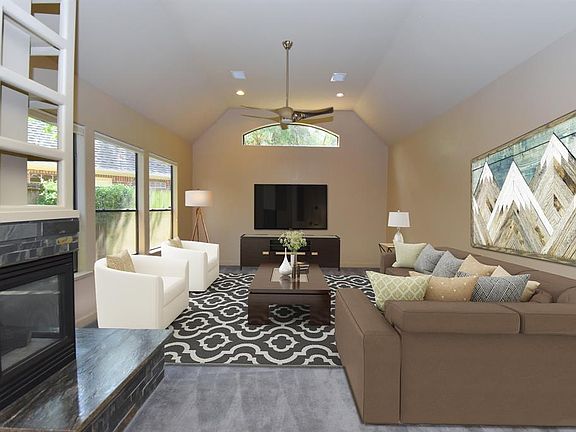 This is the Family Room that has been virtually staged, giving you an idea in the potential of this functional space.