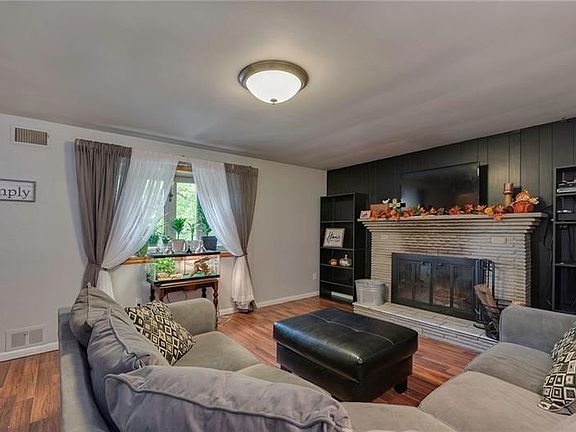 The beautiful bay window brings a ton of natural light into the living room.