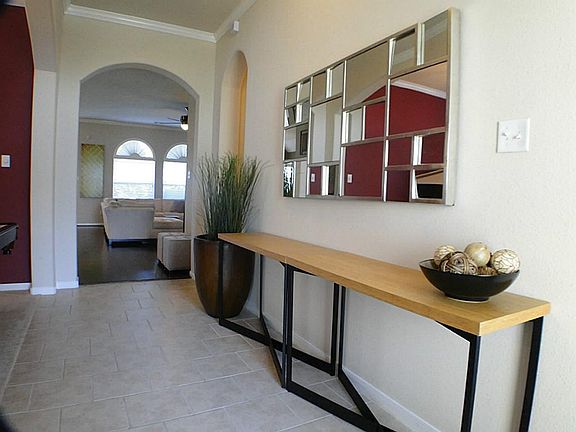 Walk into a tiled entry and enter into the family room through the beautiful arched entry.
