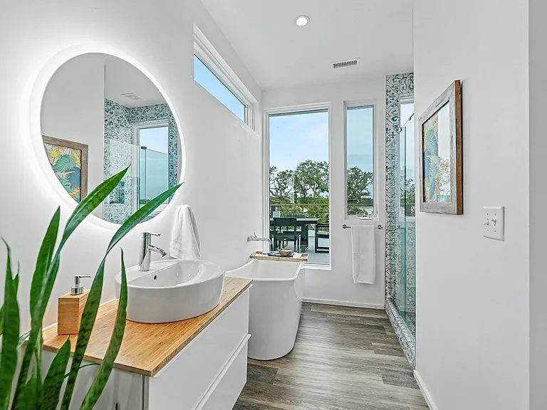Primary ensuite bathroom with walk-in shower and tub