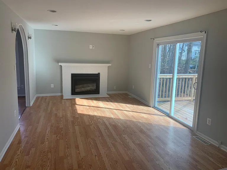 Family room with New Gas FIreplace with Remote. Double Sliding Glassdoors to Deck