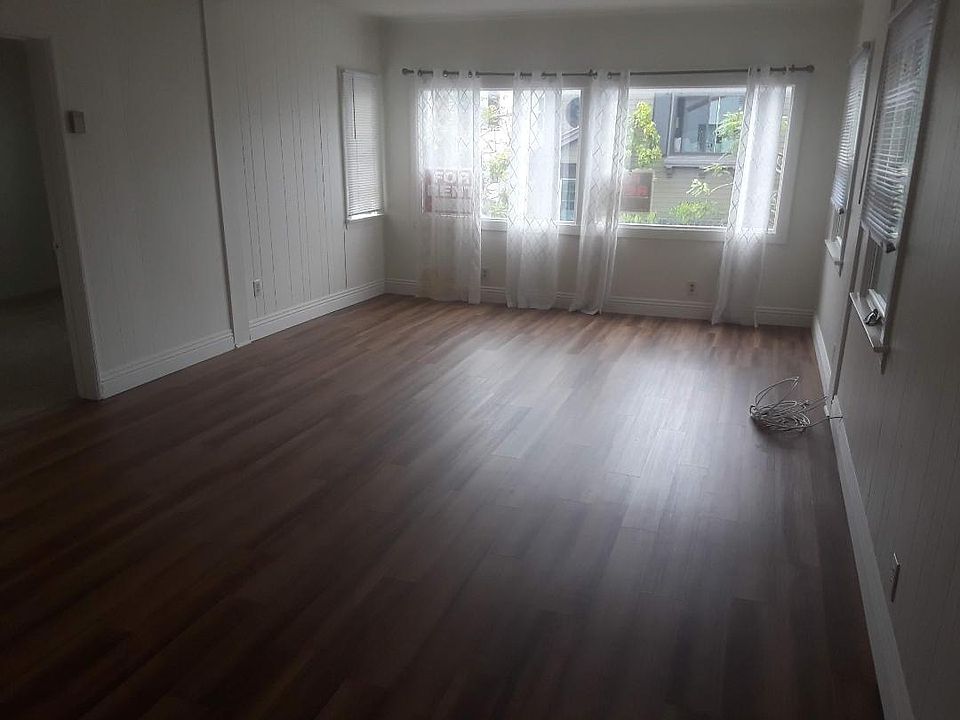 dining and living room adjoin, ceiling fan, sorry for the dark picture- is very bright room with view to south and west