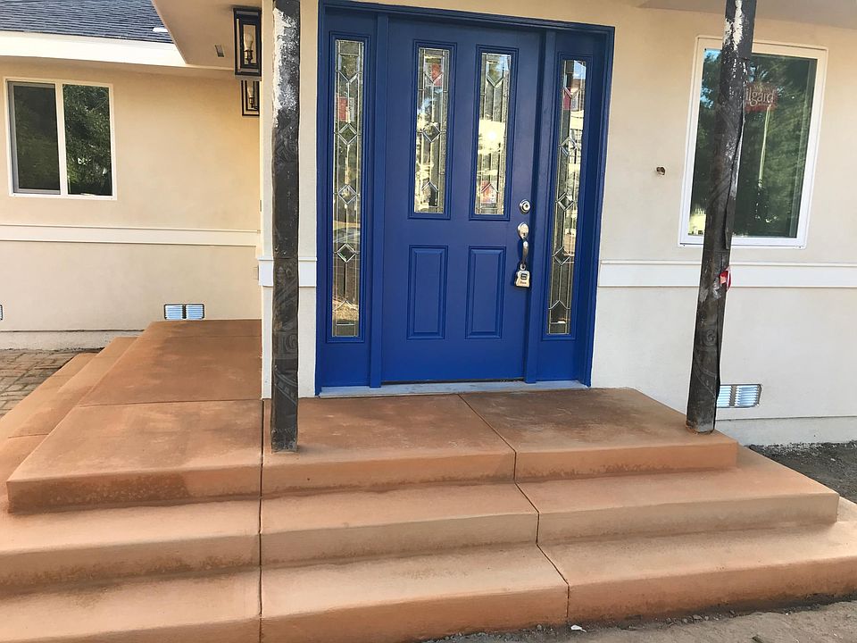 Beautiful entry door with wrap around patio with private yard