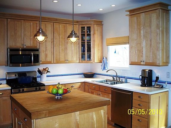 Kitchen with Island and Shaker Cabinetry
