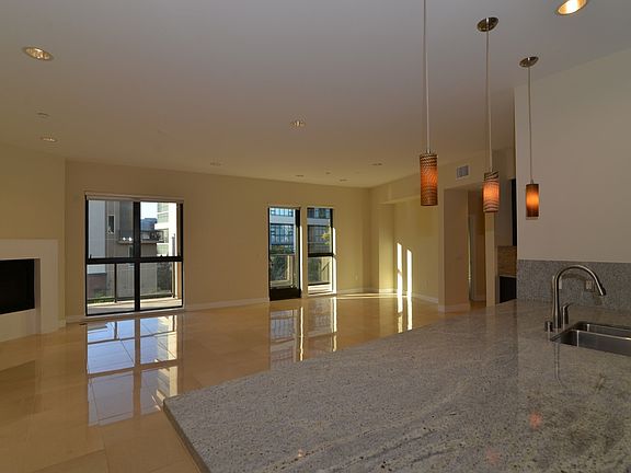 Great Room with Beautiful Porcelain Tiles and Fireplace