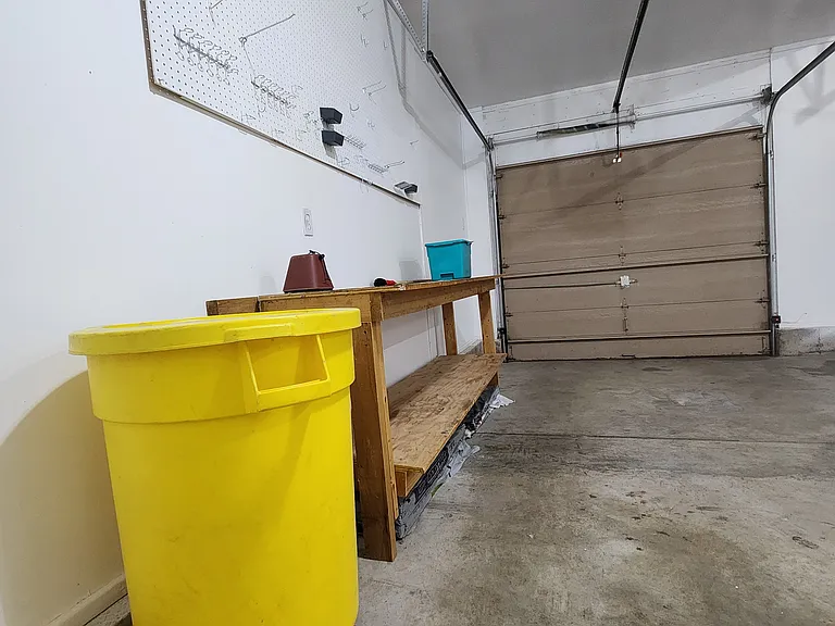 Large workbench with pegboard above