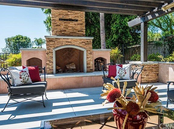 Outdoor fireplace provides a focal point and entertainment center