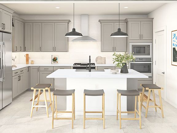 Kitchen with staggered cabinets, pendant lighting and matte black fixutures