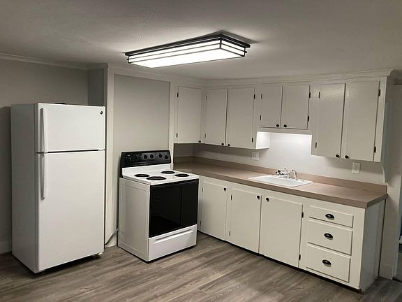 Large open kitchen with new flooring