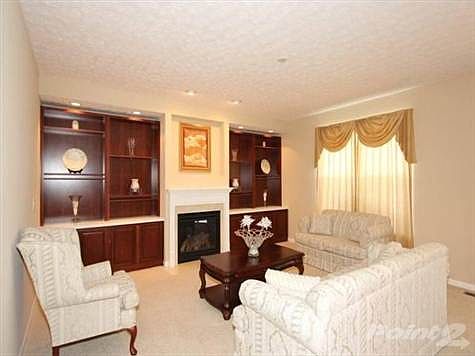 Cozy family room with gas fireplace and beautiful built-in book shelves. Smart wiring for surround sound and TV.