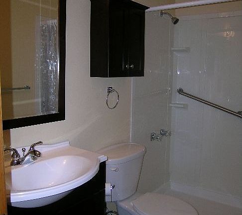 Remodeled bath with cherry cabinets and mirror!