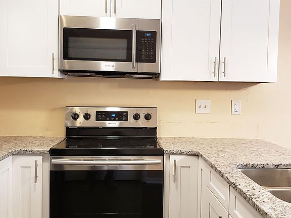 Eat-In Kitchen w/Granite Counters, White Cabinets & Stainless-Steel Appliances