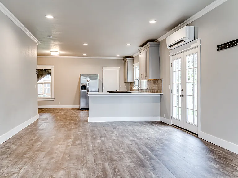 The livingroom meanders to the kitchen which boasts breakfast bar seating for 3-4 people.