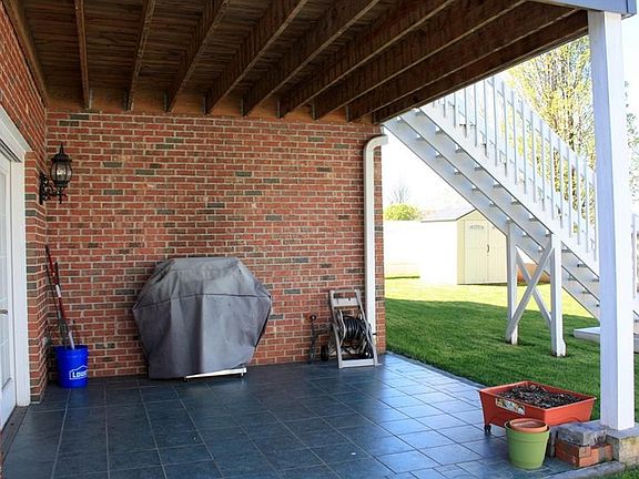 Patio area below screened-in Deck perfect for entertaining.