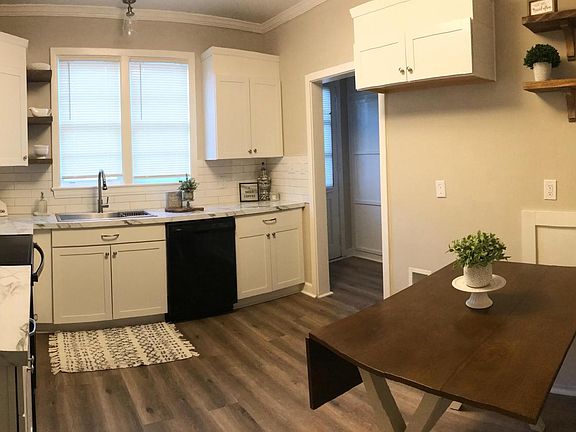 Kitchen with built in Breakfast Area and view into Laundry Room