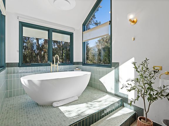 Step into serenity_natural light and elegant finishes set the scene.