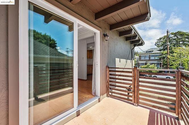 Private balcony with open neighborhood views _ afternoon sun