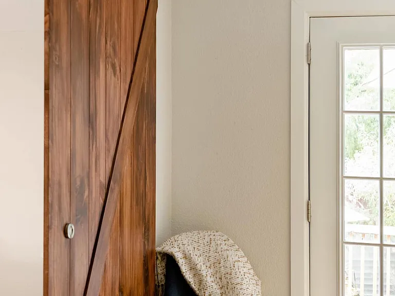 It has the only door to the backyard.