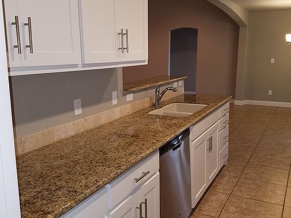 Ceramic tile in all rooms except bedrooms