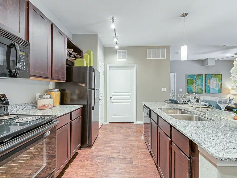 Latigo at Eagle Pass Kitchen with Black Appliances and Granite Countertops