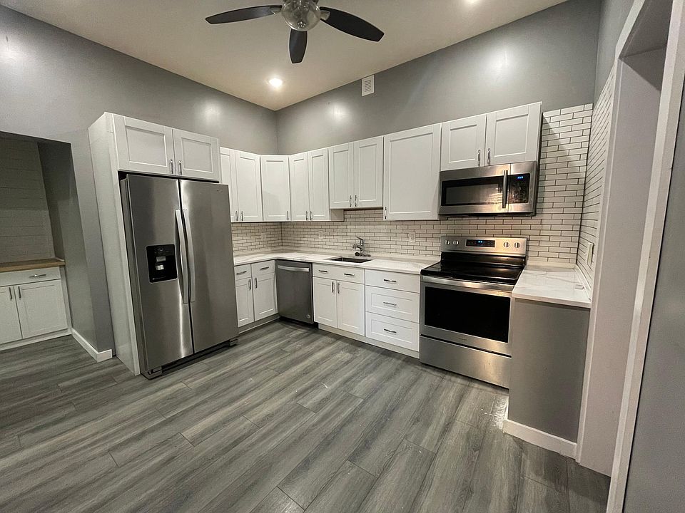 Large kitchen with stainless steel appliances