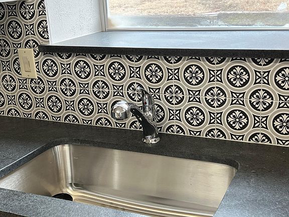 Charming new backsplash and granite countertops