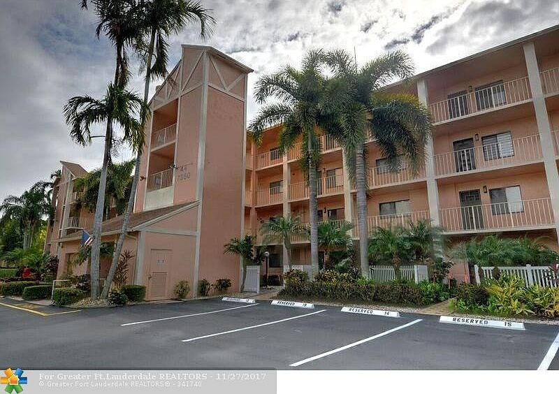 Front of Building - 4 stories with elevator, 1 assigned parking spot and plenty of guest spots