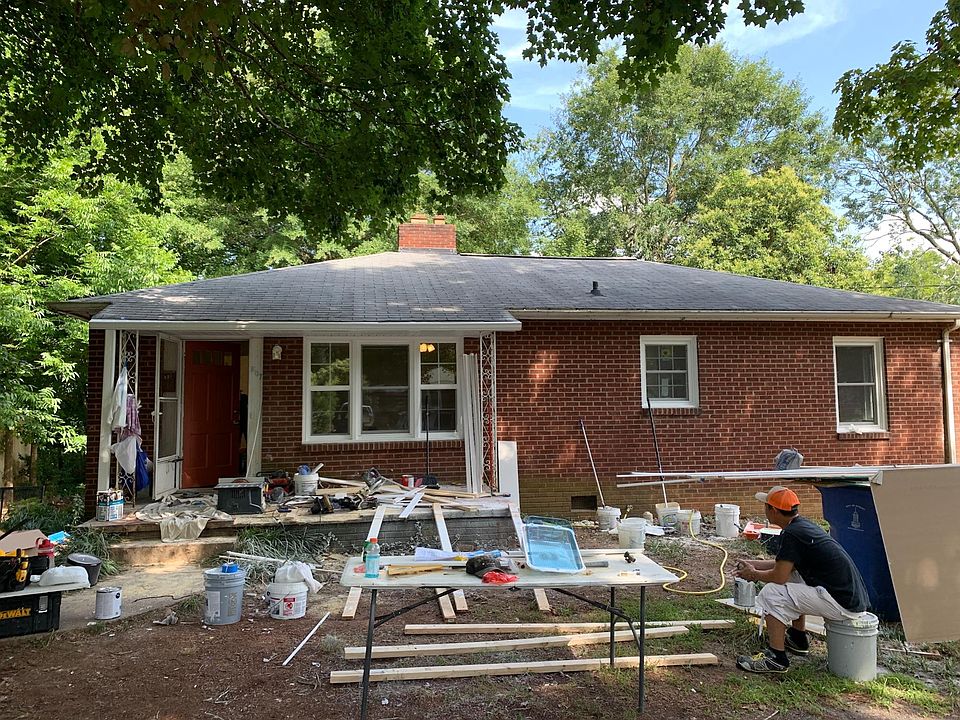 FRONT OF THE HOUSE! " In the process of finishing up and cleaning interior & exterior of the house."