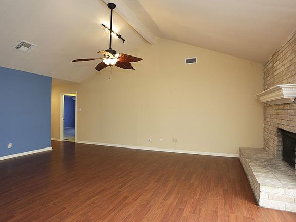 LIVING ROOM - View from dining area - Another view of this spacious living area. High ceilings are complete with lots of lighting and celling fans for easy air circulation.