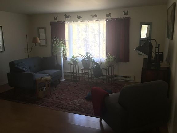 Living room with fabulous view facing fields, river.
