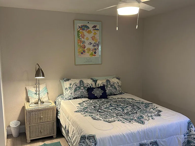 Cozy bedroom with huge closet and access to laundry and back patio and yard.