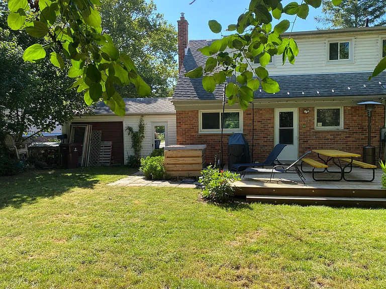 Back of house and garage from yard