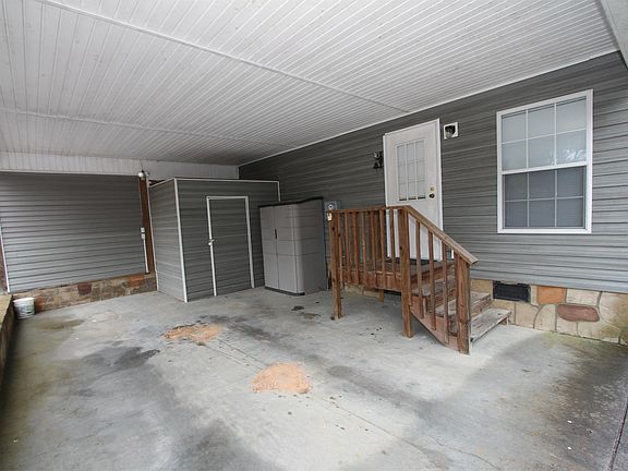 This carport means you won't scrape ice in the winter or get