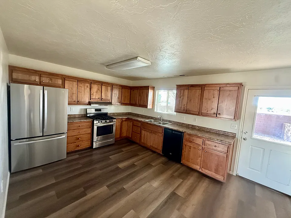 Kitchen with door to the enclosed back yard