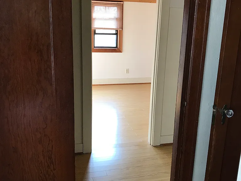 Hallway view into upstairs east bedroom